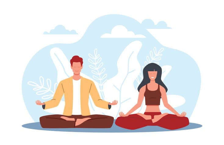 Man and woman do yoga and meditate together